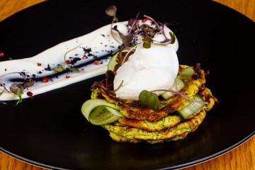 Zucchini pancake with cream