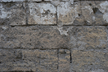 Old brick wall of loose shell rock.