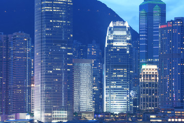 Hong Kong business district city skyline at dusk.