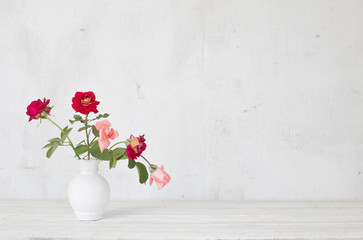  flowers in vase on white background