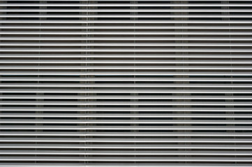 Modern architecture, detailed view of the window with pre-jaw blinds.