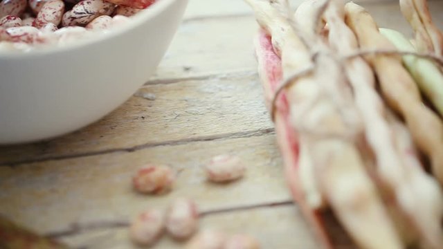 Close up shot of  fresh raw  kidney bean pods on table.