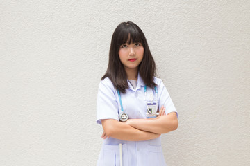 The woman Asian doctor  White Shirt suit with stethoscope working outdoor Hospital.