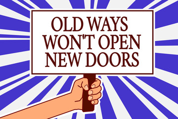 Text sign showing Old Ways Won t not Open New Doors. Conceptual photo be different and unique to Achieve goals Man hand holding poster important protest message blue rays background.