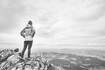 Woman on top of mountain