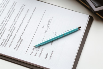 Legal contract signing - buy sell real estate contract