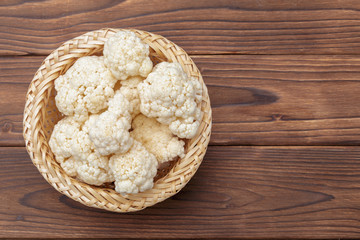 Organic cauliflower on wooden background