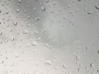 Rain drop on the mirror of car