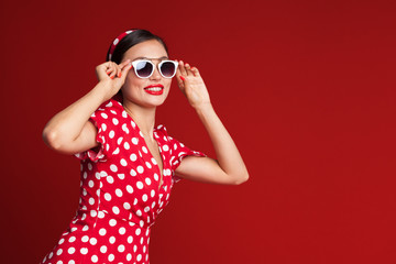 Portrait of a funny emotional young woman. Pin-up style.