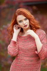 Naklejka premium Outdoor lifestyle photo of young beautiful lady. red hair . Warm autumn. Warm spring