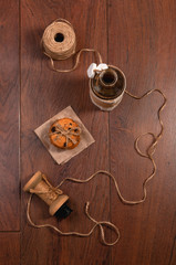 Sweet cookies with chocolate, cinnamon and milk. Set-up on wood background