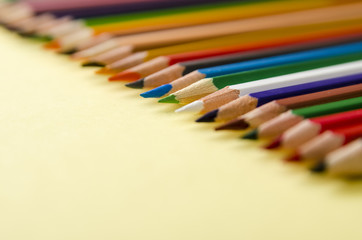 back to school, pencils of different colors on a wooden background, preparation for school