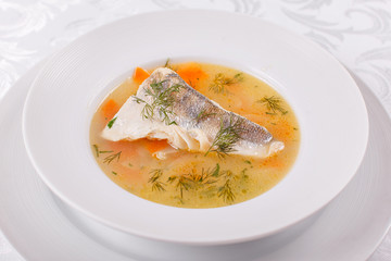 Fish and seafood soup . Delicious soup with white fish and vegetables for dinner