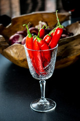 Red peppers in a wineglass