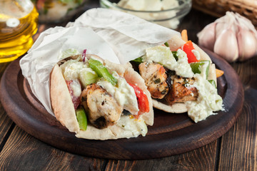 Gyros souvlaki wrapped in a pita bread