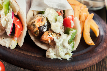 Gyros souvlaki wrapped in a pita bread