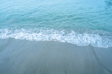 Fototapeta na wymiar Soft beautiful ocean wave on sandy beach