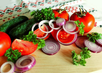 Fresh vegetables on the cutting Board on the table.