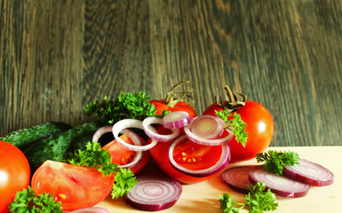 Fresh vegetables on the cutting Board on the table.