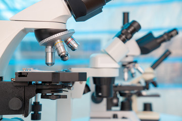 Four microscopes of different designs in the laboratory