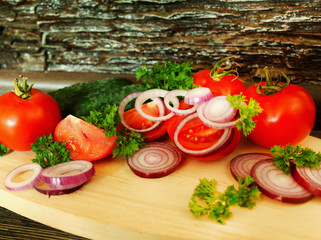 Fresh vegetables on the cutting Board on the table.