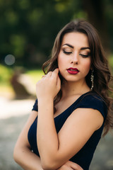 Fototapeta premium Portrait of beautiful girl with prifessional makeup and hair style