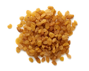 Heap of yellow raisins isolated on white background. Top view.