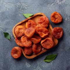 Dried apricots on gray background with copy space. Top view.