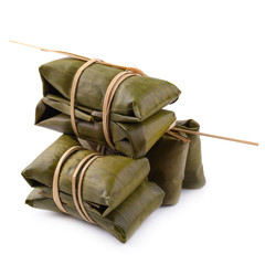 Thai dessert style which insert banana and black Peas inside to sticky rice isolated on white...