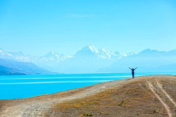 Summertime, Asian woman enjoy travel at lake pukaki as a Mt. Cook Background , South island New...