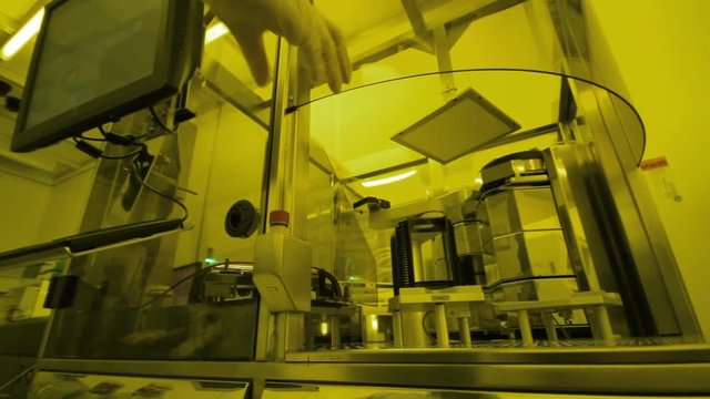 Scientists Working In A Microsystems Cleanroom Facility
