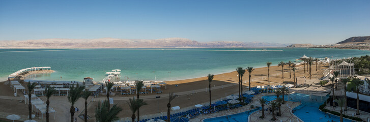 Panoramic view the dead sea from Ein Bokek beach shore 