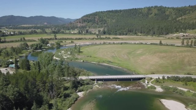 Aerial View of River Foothills and Farmland Road Bridge with - Priest River Idaho
