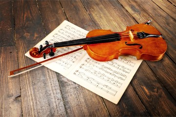 Violin And Musical Notes on desk