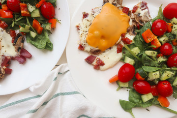 egg with bacon, cheese, mushrooms and vegetable salad