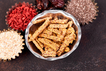 Various superfoods in small bowl near granola