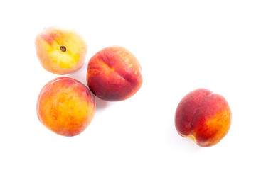 Group of ripe peach fruit isolated on white background.