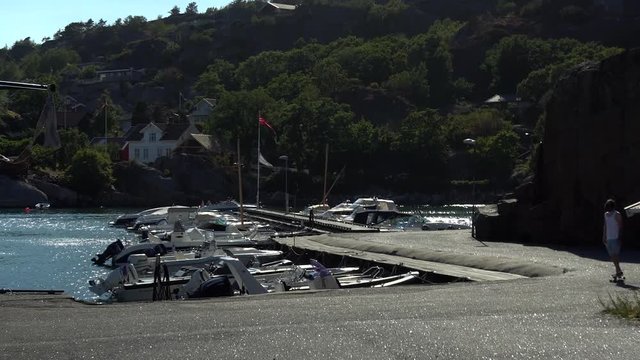 Riding longboard at the docks in Kjerringvik, Norway