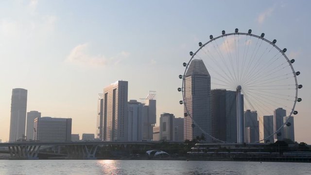Singapore business district city with the Singapore Flyer gian Ferris wheel