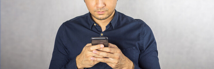 Man typing on phone screen close up