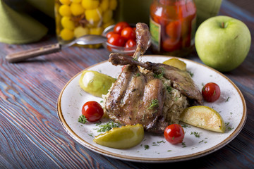 Duck leg with sauerkraut, apple and cherry tomatoes
