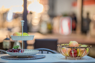 Flower vase and arrangement of dishes to prepare the use, the back floor has a beautiful bokeh, colorful background.