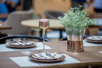 Flower vase and arrangement of dishes to prepare the use, the back floor has a beautiful bokeh, colorful background.