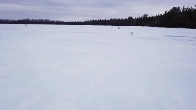 Fly over the ice of Fitzgerald Pond, Maine.