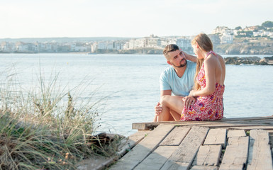 Fototapeta premium Romantic young couple on the beach. Young couple enjoy each other on vacation.