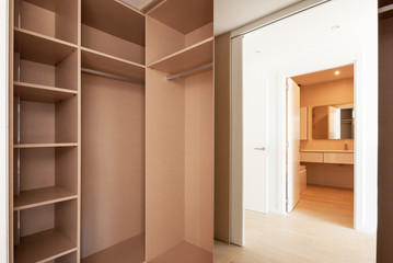 Fototapeta premium Empty built-in wardrobes. New house, empty rooms.