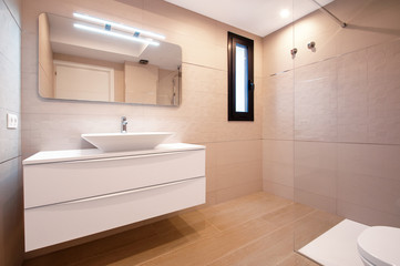 Fototapeta na wymiar Modern design in the bathroom. Luxury white porcelain sink on a bathroom table.