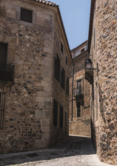 Fototapeta na wymiar Typical narrow street of the old town of Caceres, Spain
