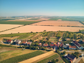 Fototapeta na wymiar Aerial view of fields and houses, Czech Republic