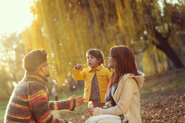 Blowing soap bubbles